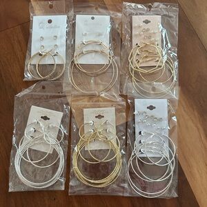 Large group of silvertone and goldtone hoop earrings